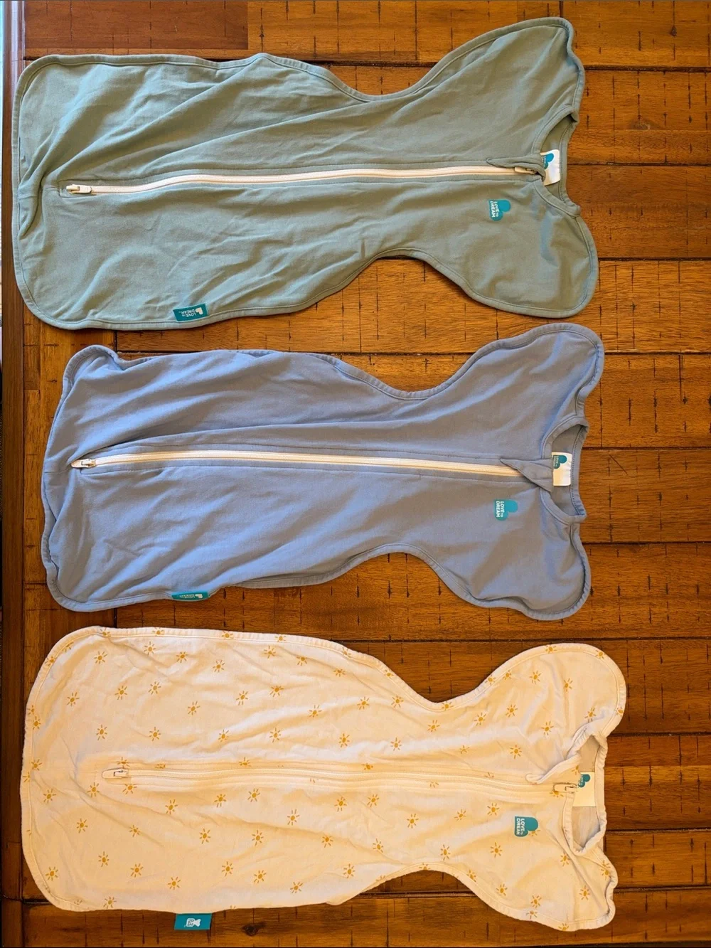 Love to dream zip swaddles x3 in Sage, Blue, and Cream with Yellow Accent